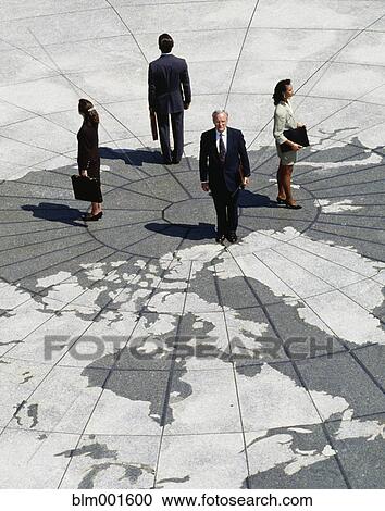 Businesspeople standing on map of globe View Large Photo Image Stock Image - Businesspeople standing on map of globe. Fotosearch
