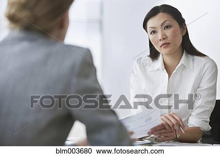 Stock Image - Businesswomen in meeting. Fotosearch