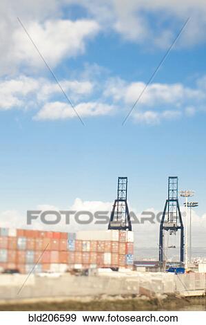 Stock Photo - Cargo Containers and Loading Cranes. Fotosearch
