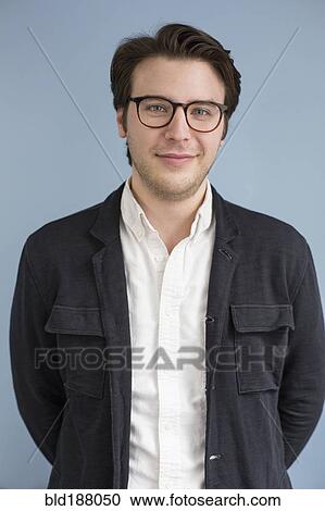 Stock Image - Caucasian businessman smiling. Fotosearch