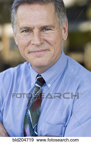 Stock Photo - Caucasian businessman smiling. Fotosearch