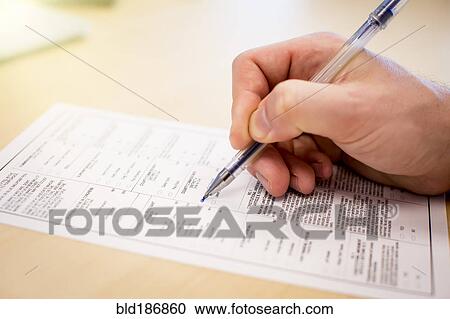 Caucasian businessman writing paperwork View Large Photo Image Stock Image - Caucasian businessman writing paperwork. Fotosearch