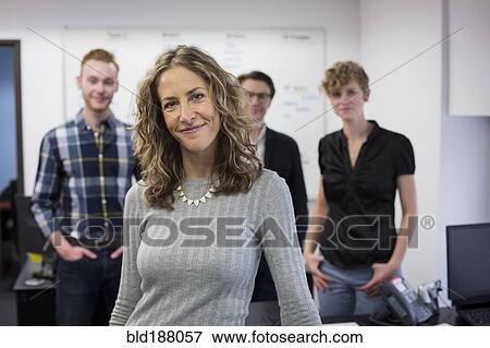Caucasian businesswoman smiling in office View Large Photo Image Stock Photo - Caucasian businesswoman smiling in office. Fotosearch