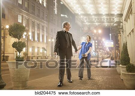 Caucasian couple holding hands outdoors View Large Photo Image Stock Photography - Caucasian couple holding hands outdoors. Fotosearch