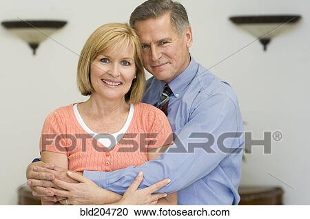 Caucasian couple hugging View Large Photo Image Stock Image - Caucasian couple hugging. Fotosearch