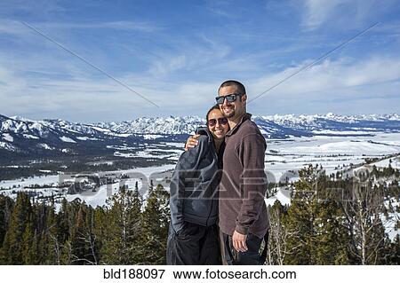 Caucasian couple smiling near remote landscape view View Large Photo Image Stock Photo - Caucasian couple smiling near remote landscape view. Fotosearch