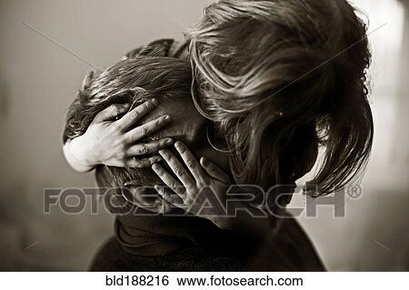 Caucasian daughter hugging head of father View Large Photo Image Stock Photograph - Caucasian daughter hugging head of father. Fotosearch