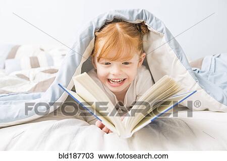 Caucasian girl reading book in bed View Large Photo Image Stock Image - Caucasian girl reading book in bed. Fotosearch