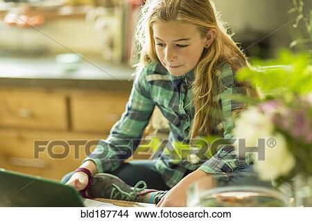 Picture - Caucasian girl using laptop. Fotosearch