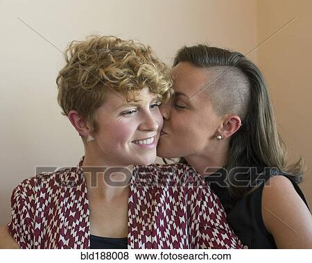Stock Photo - Caucasian lesbian couple kissing. Fotosearch