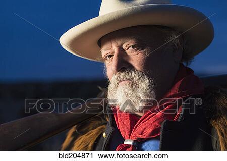 Caucasian man holding gun outdoors View Large Photo Image Stock Image - Caucasian man holding gun outdoors. Fotosearch