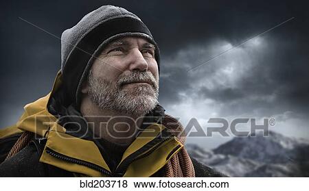 Caucasian man standing in snowy landscape View Large Photo Image Stock Photo - Caucasian man standing in snowy landscape. Fotosearch