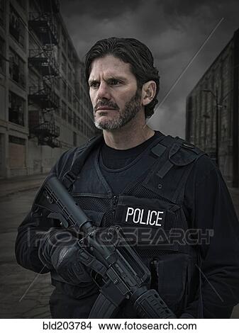 Caucasian policeman on city street View Large Photo Image Picture - Caucasian policeman on city street. Fotosearch