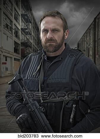 Caucasian policeman on city street View Large Photo Image Stock Image - Caucasian policeman on city street. Fotosearch
