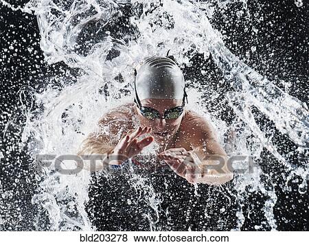 Caucasian swimmer splashing in water View Large Photo Image Stock Photo - Caucasian swimmer splashing in water. Fotosearch