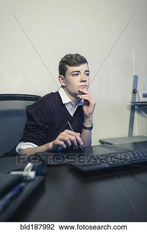 Caucasian teenage boy using computer View Large Photo Image Stock Image - Caucasian teenage boy using computer. Fotosearch