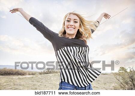 Caucasian teenage girl cheering View Large Photo Image Stock Image - Caucasian teenage girl cheering. Fotosearch