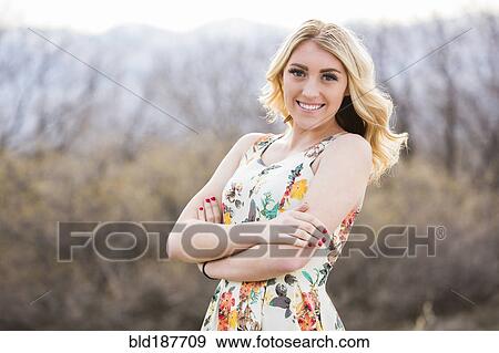 Stock Photo - Caucasian teenage girl standing outdoors. Fotosearch