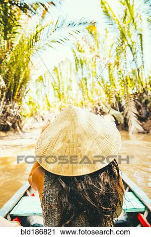 Caucasian woman floating in boat on rural river View Large Photo Image Stock Image - Caucasian woman floating in boat on rural river. Fotosearch
