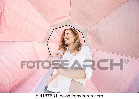 Caucasian woman holding umbrella View Large Photo Image Stock Image - Caucasian woman holding umbrella. Fotosearch