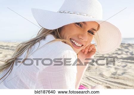 Caucasian woman laying on beach View Large Photo Image Stock Image - Caucasian woman laying on beach. Fotosearch
