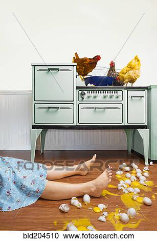 Caucasian woman on kitchen floor with broken eggs View Large Photo Image Stock Image - Caucasian woman on kitchen floor with broken eggs. Fotosearch