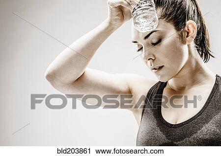 Caucasian woman resting after workout View Large Photo Image Stock Image - Caucasian woman resting after workout. Fotosearch