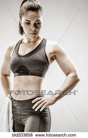 Stock Photo - Caucasian woman resting after workout. Fotosearch