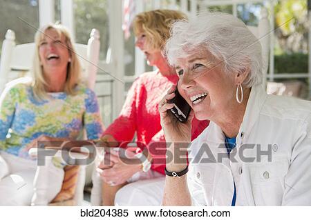 Stock Photography - Caucasian woman talking on cell phone. Fotosearch