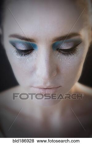 Stock Photo - Caucasian woman wearing glamorous makeup. Fotosearch