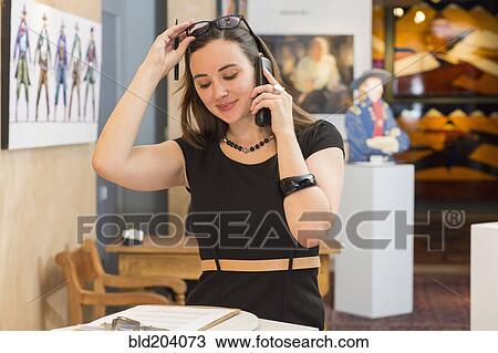 Caucasian woman working in art gallery View Large Photo Image Stock Image - Caucasian woman working in art gallery. Fotosearch