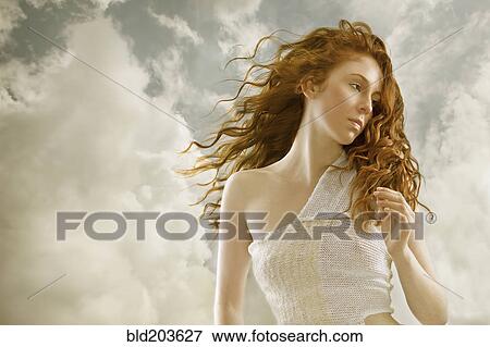Stock Photo - Caucasian woman's hair blowing in wind. Fotosearch
