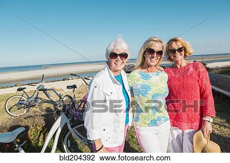 Caucasian women smiling outdoors View Large Photo Image Stock Image - Caucasian women smiling outdoors. Fotosearch