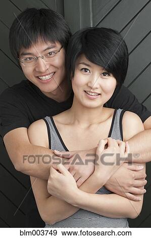 Chinese couple hugging View Large Photo Image Stock Photo - Chinese couple hugging. Fotosearch