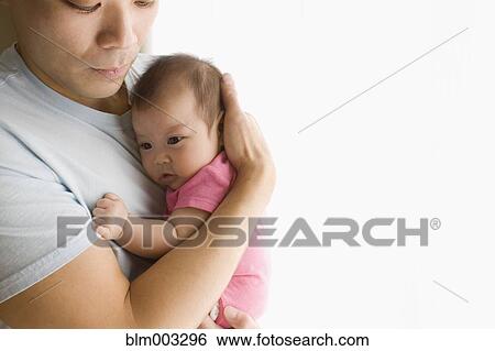 Chinese father holding baby daughter View Large Photo Image Stock Photograph - Chinese father holding baby daughter. Fotosearch