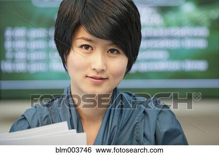 Chinese newscaster smiling View Large Photo Image Stock Photograph - Chinese newscaster smiling. Fotosearch