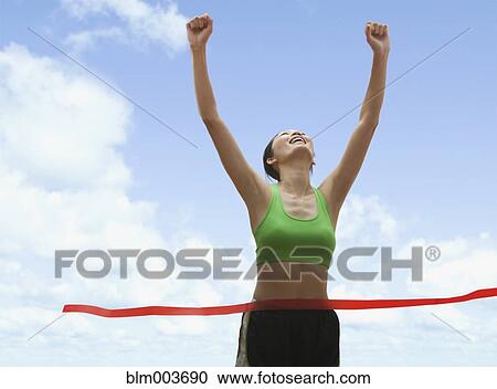 Chinese runner crossing finish line View Large Photo Image Stock Image - Chinese runner crossing finish line. Fotosearch