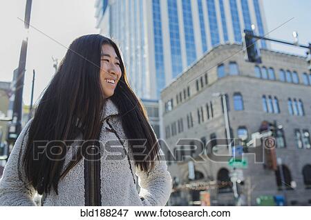 Chinese teenage girl smiling outdoors View Large Photo Image Stock Photo - Chinese teenage girl smiling outdoors. Fotosearch