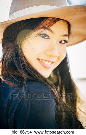 Chinese woman smiling outdoors View Large Photo Image Picture - Chinese woman smiling outdoors. Fotosearch