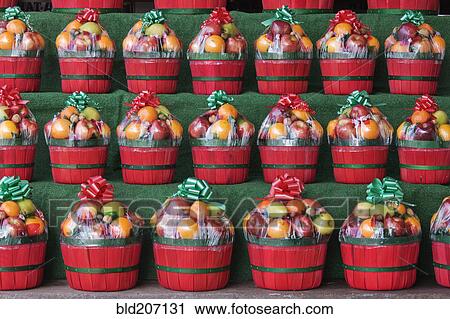 Stock Image - Christmas Fruit Baskets on Shelves. Fotosearch
