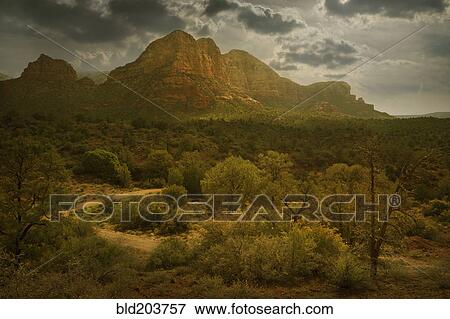 Stock Photo - Cliffs overlooking rural landscape, Sedona, Arizona, United States. Fotosearch
