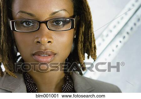 Close up of African businesswoman in eyeglasses View Large Photo Image Stock Image - Close up of African businesswoman in eyeglasses. Fotosearch