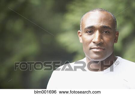 Close up of African man outdoors View Large Photo Image Stock Photograph - Close up of African man outdoors. Fotosearch