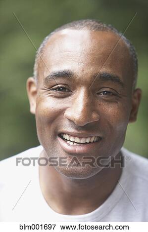 Close up of African man smiling View Large Photo Image Stock Photo - Close up of African man smiling. Fotosearch