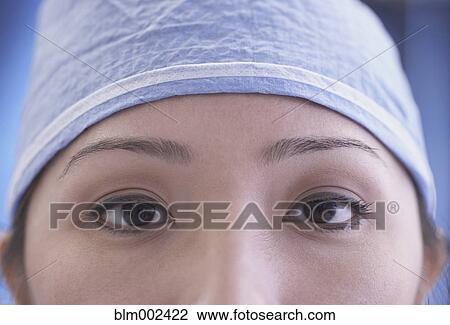 Stock Image - Close up of Asian female medical professional. Fotosearch