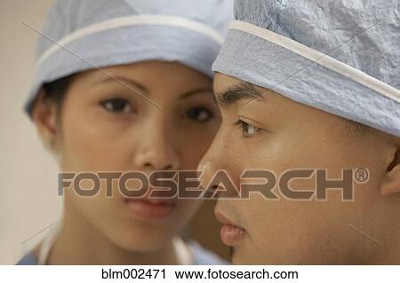 Stock Image - Close up of Asian medical professionals. Fotosearch