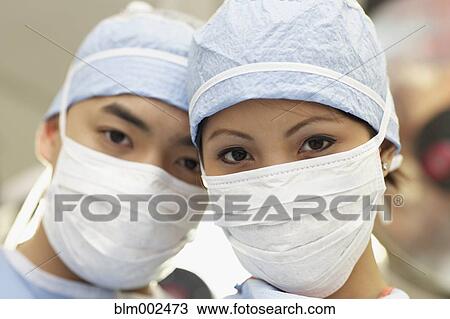 Stock Image - Close up of Asian medical professionals. Fotosearch