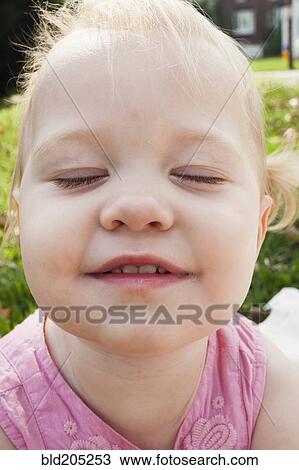 Stock Image - Close up of Caucasian girl's face. Fotosearch