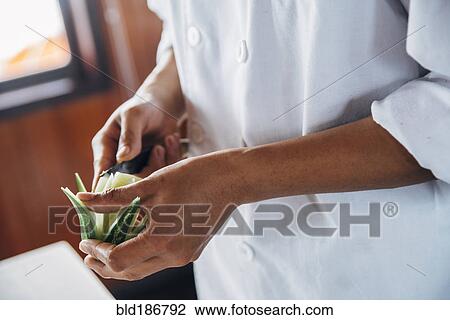 Close up of chef cutting decorative lime View Large Photo Image Stock Image - Close up of chef cutting decorative lime. Fotosearch