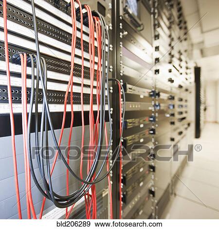 Close up of computer servers and cords in server room View Large Photo Image Stock Photo - Close up of computer servers and cords in server room. Fotosearch